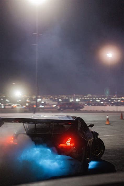 A Black Car on the Road at Night · Free Stock Photo