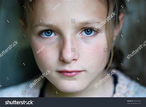 Sad Little Girl Is Looking With Serious Face At Camera. Stock Photo 50414224 : Shutterstock