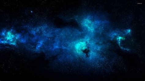 Blue nebula illuminating the darkness of the space wallpaper - Space ...