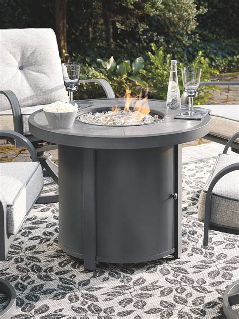 Donnalee Bay - Dark Gray - Round Fire Pit Table - EZ Furniture Sales & Leasing