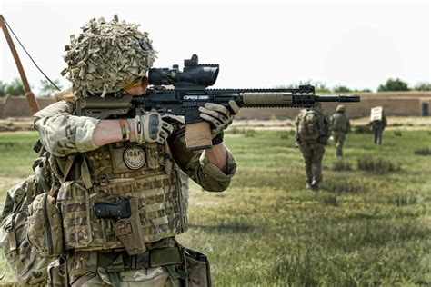 British Army Soldier from Brigade ReconnaissanceForce (BRF) 1st Mechanized Brigade takes aim ...