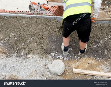 Groundworker Placing Edging Pin Kerb On Stock Photo 2047032557 | Shutterstock