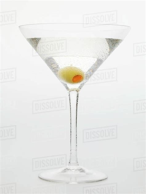 Martini with green olive - Stock Photo - Dissolve