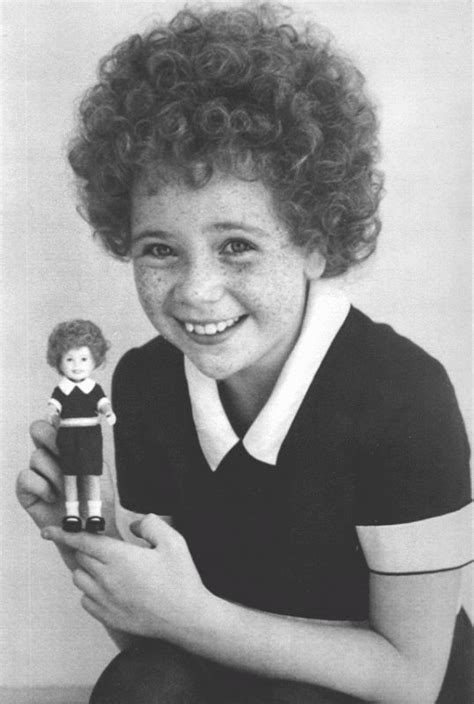 Aileen Quinn | Aileen Quinn holds up an Annie doll modeled after her likeness | Musical movies ...