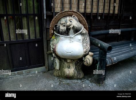 The cute japan raccoon dog statue at Magome Stock Photo - Alamy