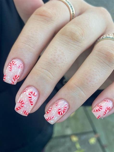 candy cane nails: shimmery white nails with candy cane accents ...