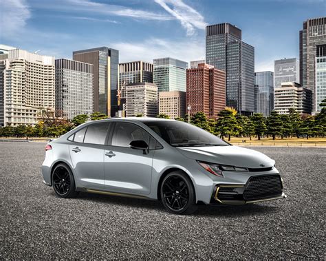 Front side view of 2021 Toyota Corolla Apex in Cement Grey in front of a city - Charlesglen Toyota