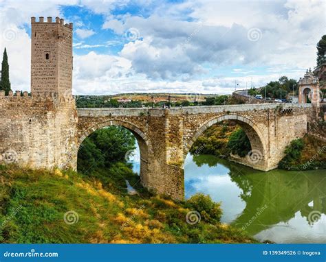 The Puente De Alcantara is a Roman Arch Bridge in Toledo, Spain, Spanning the Tagus River ...