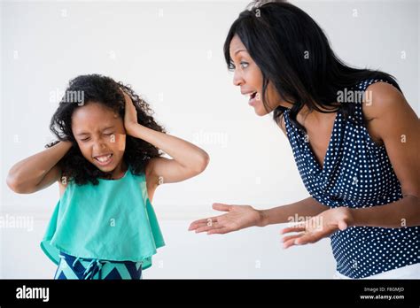 Daughter ignoring yelling mother Stock Photo - Alamy