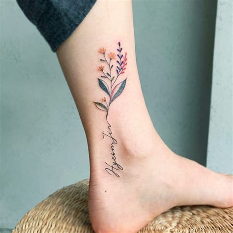 Flower and name ankle tattoo - Tattoogrid.net