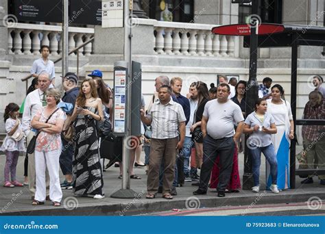 People Waiting at a Bus Stop Editorial Stock Photo - Image of covent, street: 75923683