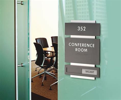 conference room sign on glass door with chairs