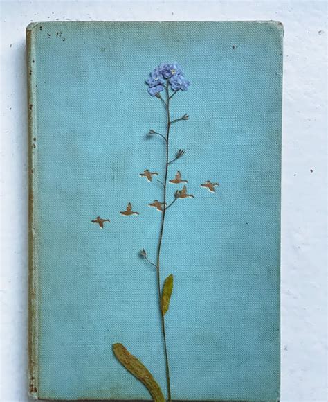 Flower on Old Book Cover · Free Stock Photo