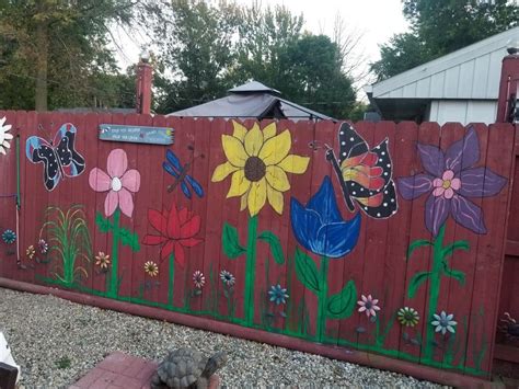 Hand painted Fence | Outdoor wall paint, Flower mural, Fence art