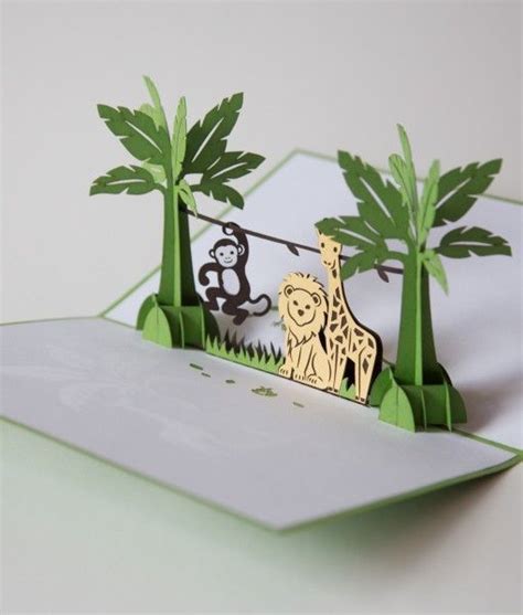 The cover of this bright green jungle card features a silhouette of a giraffe… Pop Up Art, Arte ...