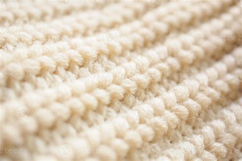 closeup beige knitted woolen fabric texture background 12739253 Stock Photo at Vecteezy