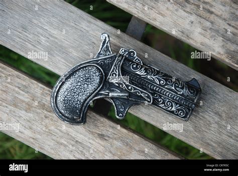 Metal toy gun hi-res stock photography and images - Alamy