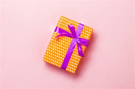 Premium Photo | Wrapped gift box with ribbon