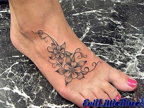 Flower And Star Tattoos On Foot