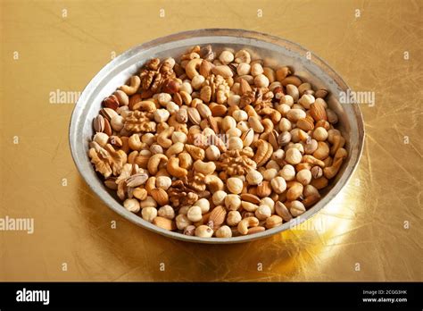 mixed nuts in copper plate Stock Photo - Alamy