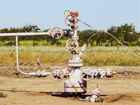 Well for Oil and Gas Production. Oil Well Wellhead . Oil Production Stock Photo - Image of ...