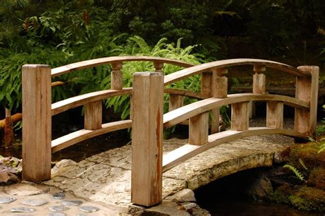 There is something so elegant about the smooth arches of a wooden bridge. This one has an aged ...