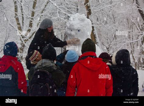 Building a snowman in Central Park, New York City Stock Photo - Alamy