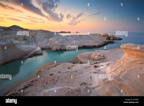 Sarakiniko beach on Milos island in sunset Stock Photo - Alamy