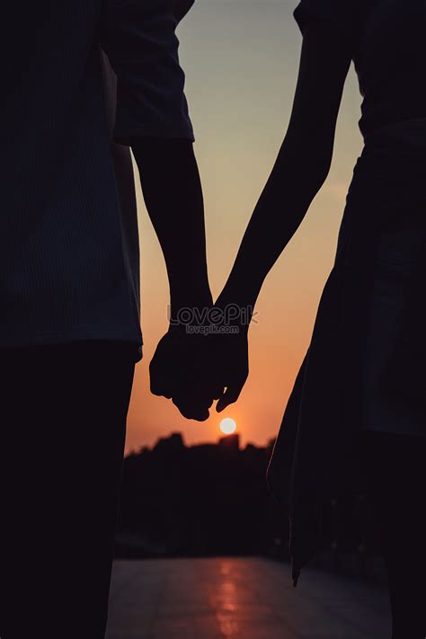 Couple In The Sunset Holding Hands Silhouette Picture And HD Photos ...