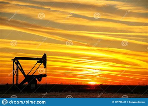 Pumpjack in the Oil Field at Sunset Stock Image - Image of environment, energy: 149798411