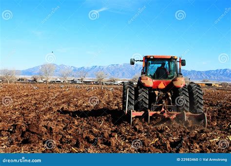 Tractor Plowing Field Stock Photo - Image: 22983460