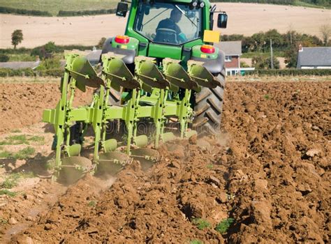 Tractor plowing the field stock photo. Image of lines - 6250832