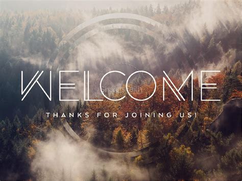 the words welcome are surrounded by fog and trees