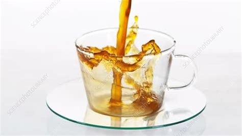 Black coffee being poured, slow motion - Stock Video Clip - K007/0359 - Science Photo Library