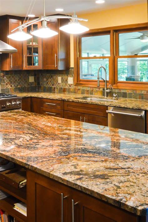 Magma Gold Granite Countertop with Dark Brown Shaker Cabinet