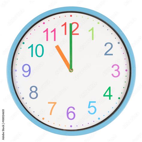 Colorful clock showing eleven o'clock Stock Photo | Adobe Stock