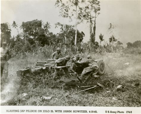 US Army soldiers firing a M101 howitzer at a Japanese pillbox, Jolo Island, 1945 | The Digital ...