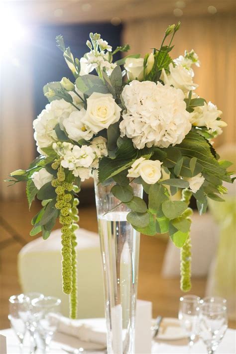 Trailing floral simple white wedding table flower centrepieces | Flower ...