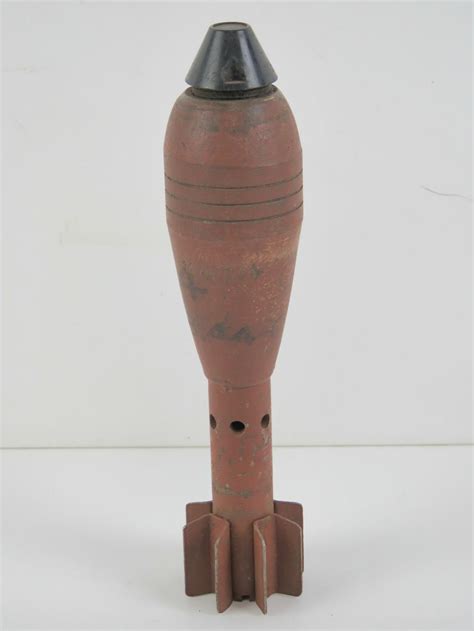 Sold at Auction: An inert WWII German 5cm mortar bomb, 22.5cm in length.