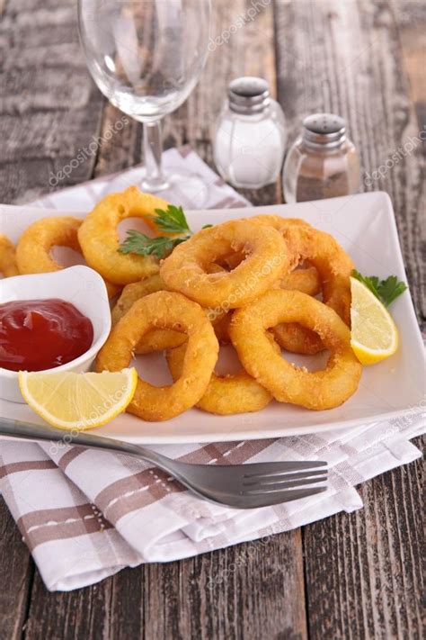 Fried calamari rings — Stock Photo © studioM #64848149