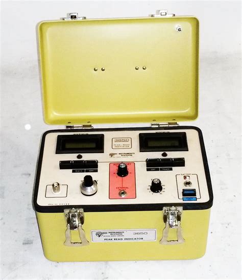 a yellow case with two electronic devices in it