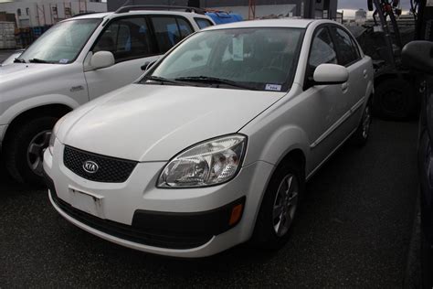 2010 WHITE KIA RIO, 99,613 KMS, VIN # KNADH4B31A6605276, GAS, AUTOMATIC, ORIGINATED OOP - QUEBEC, BC