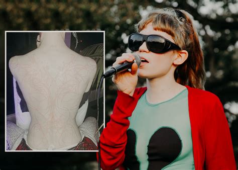 Grimes Reveals Behind-The-Scenes Snippets Of New Back Tattoo