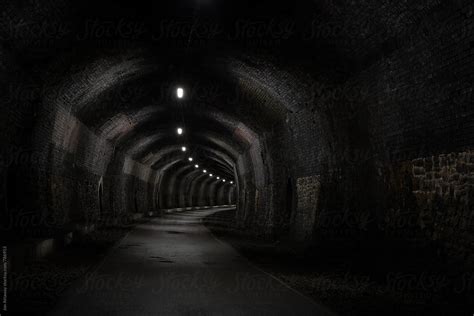 "View Into A Dark Old Railway Tunnel, Stretching Into The Distance" by Stocksy Contributor "Jon ...