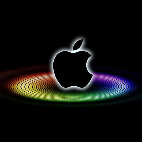 an apple logo on a black background with colored circles around it and the image is in full color