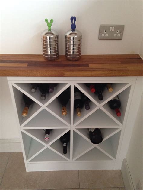 DIY wine rack -- make two of these on either side and one in the middle ...