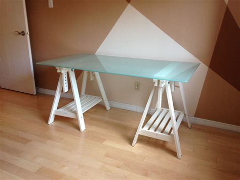 IKEA Glass desk top with adjustable white trestle legs. IKEA GLASHOLM ...