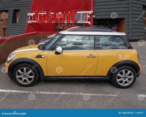 Yellow Mini car editorial photography. Image of europe - 158376787