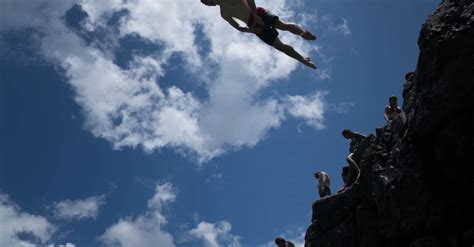 Man Diving From A Cliff · Free Stock Photo