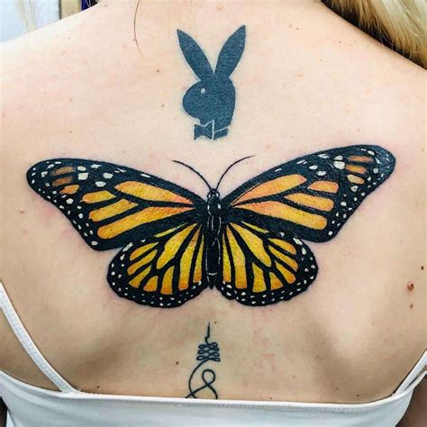 Butterfly Tattoo On Upper Back